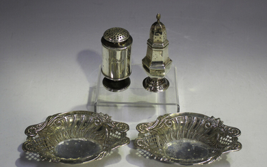 A pair of late Victorian silver oval bonbon dishes, each decorated in relief with scrolling leaf and