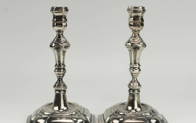 A pair of silver candle sticks