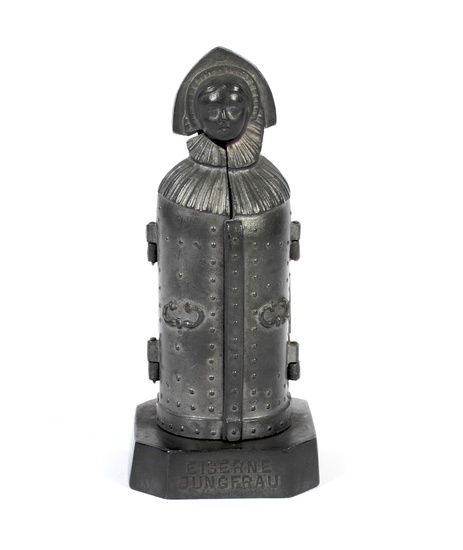 A pewter miniature model of an Iron Maiden, circa 1900. The model of the legendary torture instrument that was exhibited in Nuremberg until 1945 and destroyed in the Second World War. The hollow body with two hinged doors studded with nails to the...