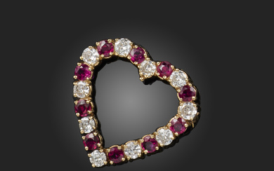 A ruby and diamond brooch/pendant, designed as a heart, set with circular-cut rubies and
