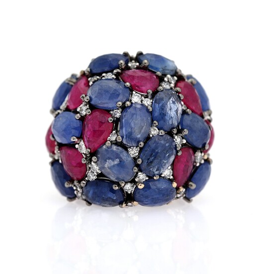 NOT SOLD. A sapphire and ruby ring set with numerous sapphires, rubies and diamonds, mounted...