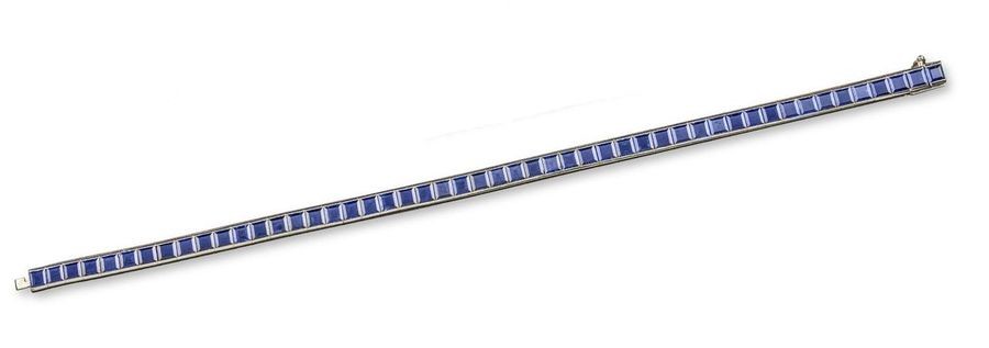 A sapphire line bracelet, set with calibre-cut sapphires...