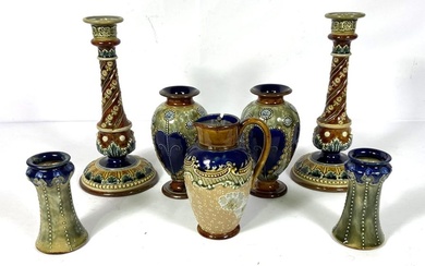 A selection of Doulton Lambeth stoneware, including a fine pair of candlesticks, with relief