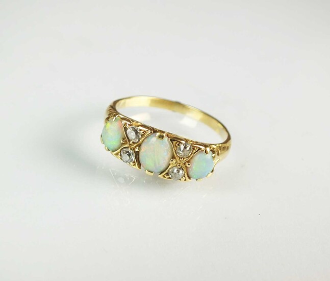 A seven stone opal and diamond ring