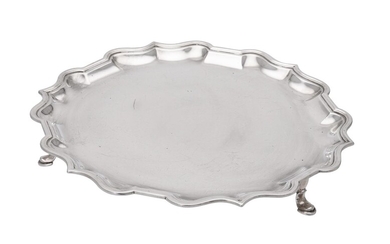 A silver shaped circular salver by C. S. Harris Ltd