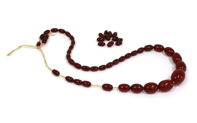 A single row graduated cherry coloured Bakelite bead necklace