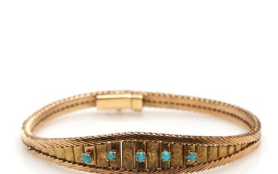 A turquoise bracelet set with cabochon turquoise, mounted in 18k gold. Weight...