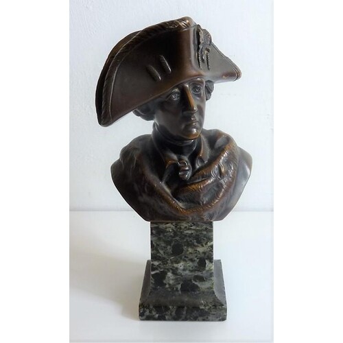 A well patinated figure of a standing bronze Napoleon wearin...