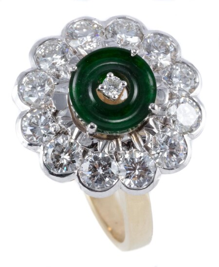 AN 18CT GOLD JADE AND DIAMOND RING; featuring a 7mm round jade ring circle centring a round brilliant cut diamond to a surround of 1...
