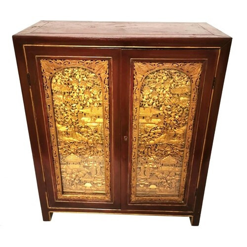 AN EARLY 20TH CENTURY CHINESE TWO DOOR SIDE CABINET With hea...