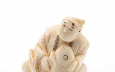 An Antique Japanese Carved Ivory Netsuke of Kinko and the Fish