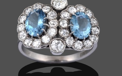 An Aquamarine and Diamond Double Cluster Ring, two oval cut...