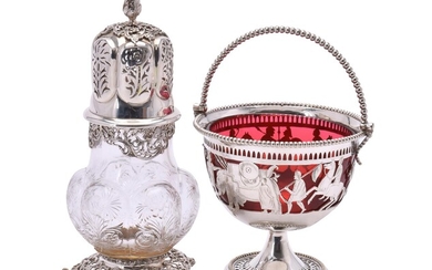 An Edwardian silver mounted clear glass sugar caster by William Comyns & Sons