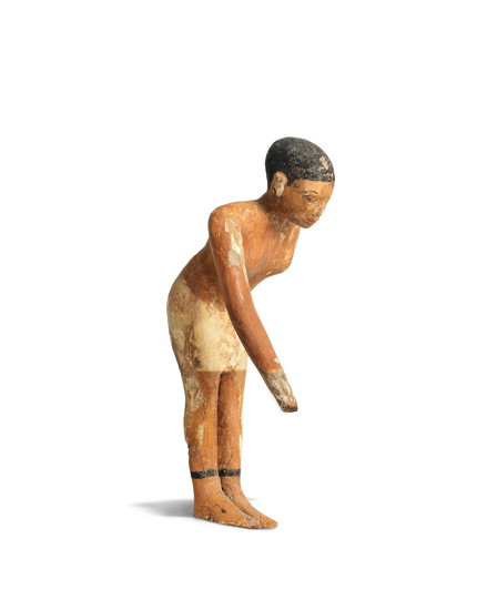 An Egyptian painted wood servant figure