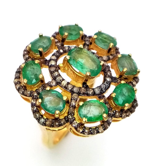 An Emerald and Diamond Gemstone Ring set in Gold...