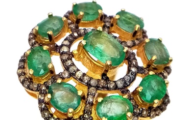 An Emerald and Diamond Gemstone Ring set in Gold...