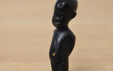 An English cast bronze figure of an African child, gilt embellishment to lips, belly button and