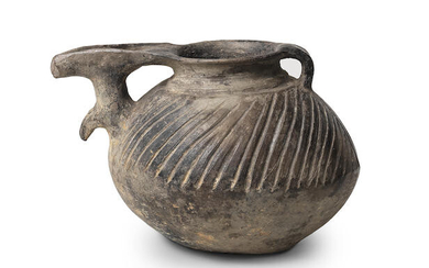 An Iranian grey-ware pottery spouted vessel