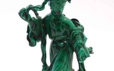 An Oriental malachite carving modelled as a woman in a