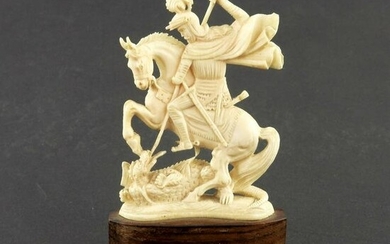 An antique carved ivory model of St Geor