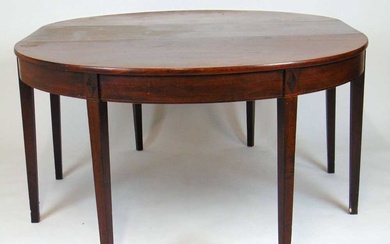 An early 19th century mahogany and boxwood strung dining table,...