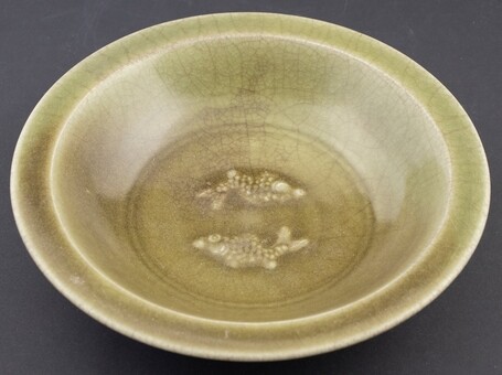 An olive green glazed 'Longquan' celadon dish with everted rim,...