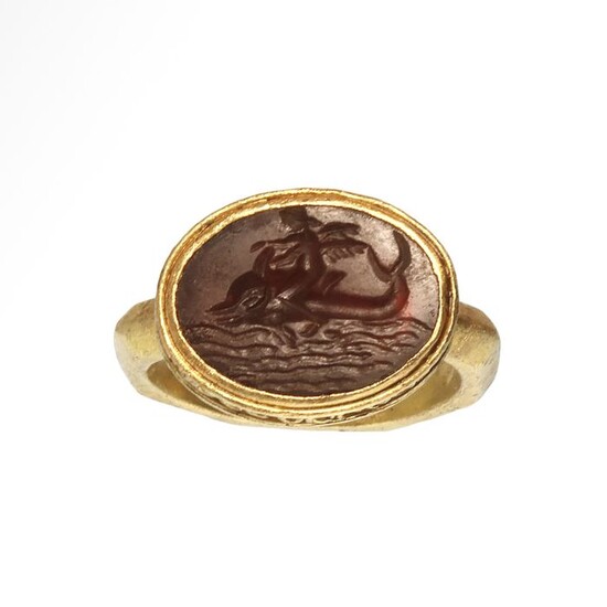 Ancient Roman Gold and Cornelian Intaglio Ring with Cupid Eros Riding a Dolphin