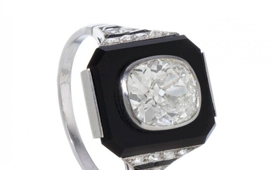 Art deco platinum onyx and diamonds ring.