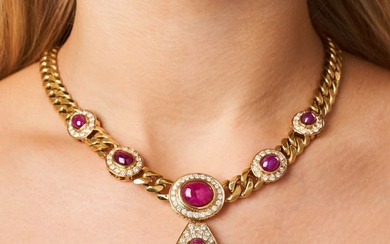BULGARI, A RUBY AND DIAMOND NECKLACE comprising a curb chain set with five oval cabochon rubies in