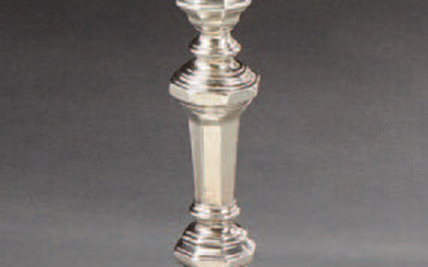 Baluster-shaped torch in plain silver, paneled model.