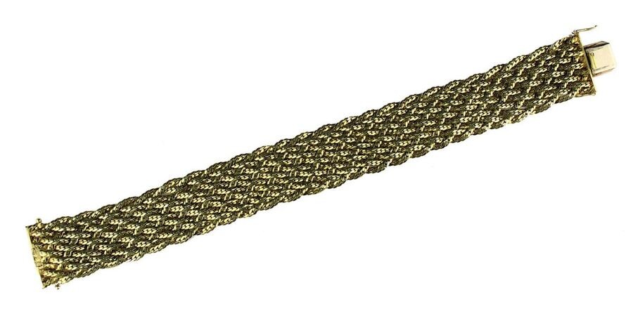 Braided yellow gold bracelet, German circa 1950, 10 braided yellow gold strands of 585 gold, hallmarked, L 19 cm, W 2.5 cm, weight 42.47 g. 2550-001