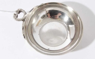 Contemporary silver wine taster of circular form with intertwined Serpent handle, (London 1972), maker L.P., 2.5oz, 11cm in diameter