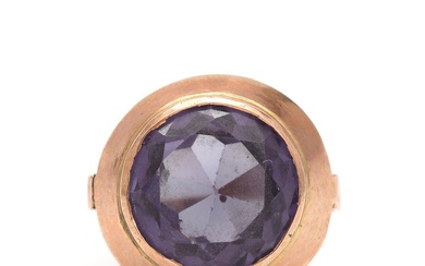 Egyptian ring set with faceted synthetic sapphire, mounted in 12k gold. Size...