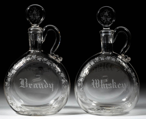 FREE-BLOWN AND ENGRAVED PAIR OF DECANTERS