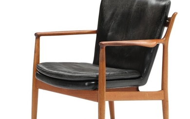 SOLD. Finn Juhl: “Delegates Chair”. A teak armchair upholstered with black leather. Made by Niels Vodder. 1950s. – Bruun Rasmussen Auctioneers of Fine Art