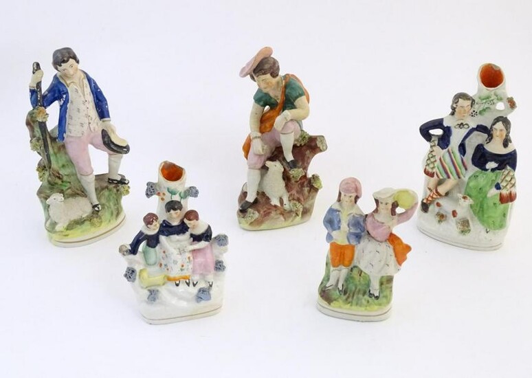 Five assorted Staffordshire pottery figures comprising