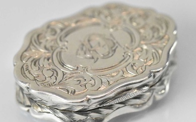 GEORGE UNITE; a Victorian hallmarked silver shaped oval vinaigrette with...