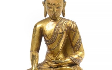 Gilt bronze "Buddha sitting on a lotus flower" with traces of polychromy. Sino-Tibetan work. Period: 16th - 17th century. (Without its copper base). H.: +/-20cm.