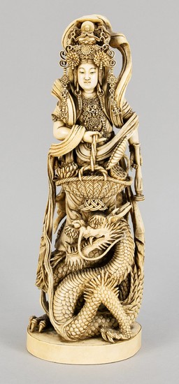 Guanyin with dragons, China, around 1900, ivory. Oval...