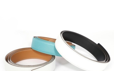 Hermès A collection comprising a reversible belt strap of white and brown...