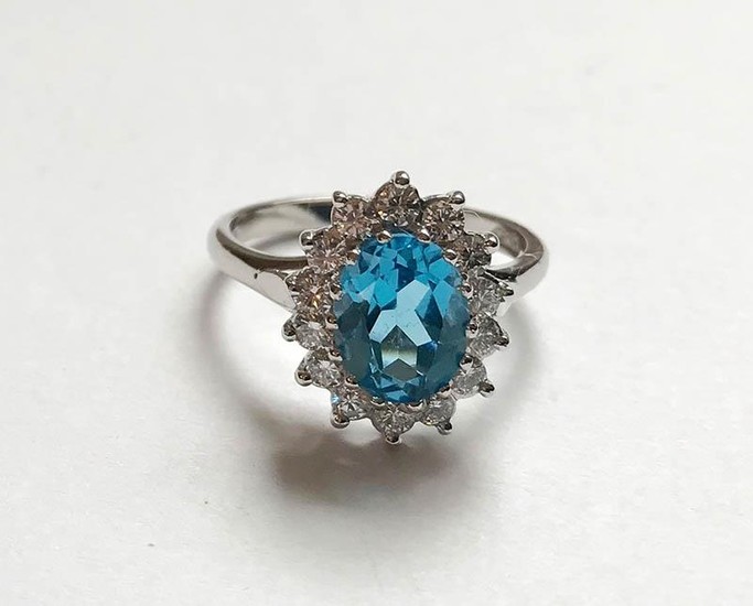 Large blue topaz and diamond cluster ring, on 18ct white gol...