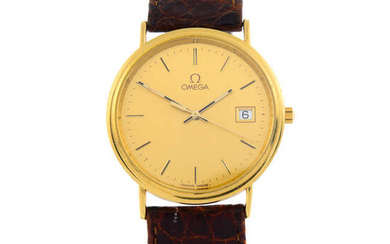 OMEGA - a yellow metal wrist watch, 32mm.