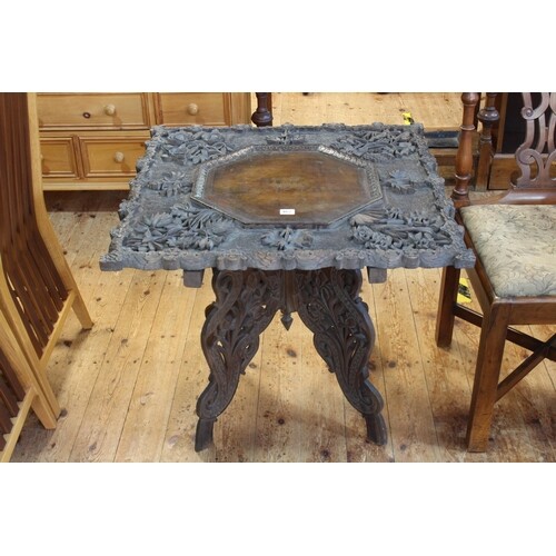 Oriental relief carved foliate and leaf occasional table wit...