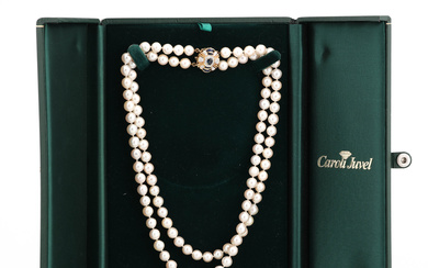 PEARL NECKLACE double row, salt water pearls, clasp in 18K gold, sapphires and brilliant cut diamonds 0.36 ct TW/SI.