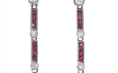 Pair of long earrings in platinum, rubies and diamonds. Partridge eye model, with two central