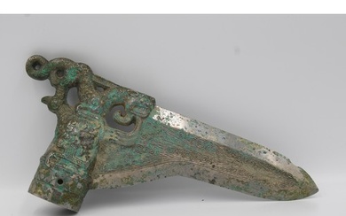 Shang Bronze dagger with dragon and phoenix decoration. Aro...