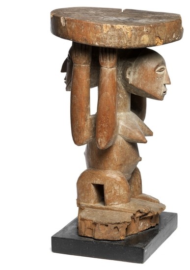 Stool of carved patinated wood with janus-figure. Hemba, D. R. Congo. H. excl. base 49 cm.