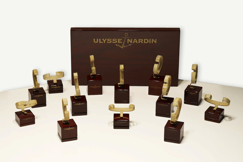 Ulysse Nardin. An Attractive Wood Display and Thirteen Watch Display Stands