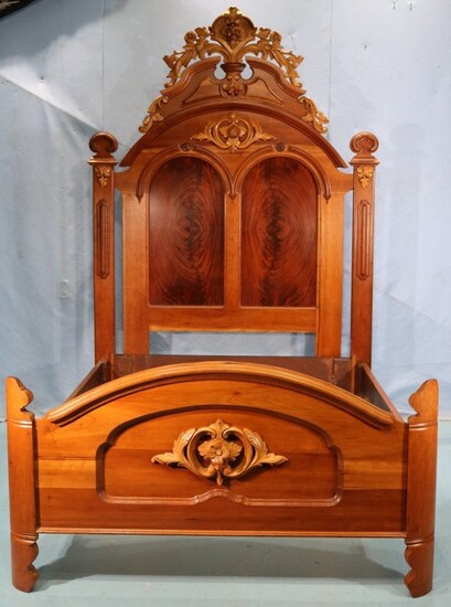 Walnut Victorian high back bed with carving