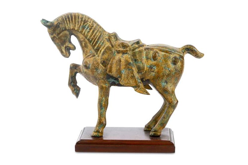 A modern patinated metal horse figure, modelled in the...